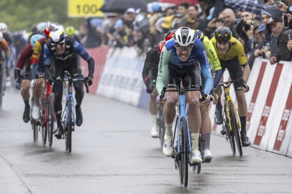 The winner of the stage, Dorian Godon from France of team Decathlon AG2R La Mondiale, crosses the finish line to win the fifth and final stage, a 150,8 km race between Vernier and Vernier at the 77th Tour de Romandie UCI World Tour Cycling race, in Vernier near Geneva, Switzerland, Sunday, April 28, 2024. (Jean-Christophe Bott/Keystone via AP)