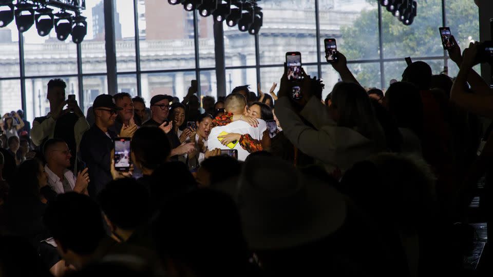 Lim and Zhou embrace at the conclusion of 3.1 Phillip Lim's Spring-Summer 2024 runway show, to cheers and applause from the audience. - But Sou Lai
