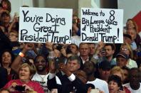 <p>Supporters of US President Donald Trump hold signs during a rally on February 18, 2017 in Melbourne, Florida. (Nicholas Kamm/AFP/Getty Images) </p>