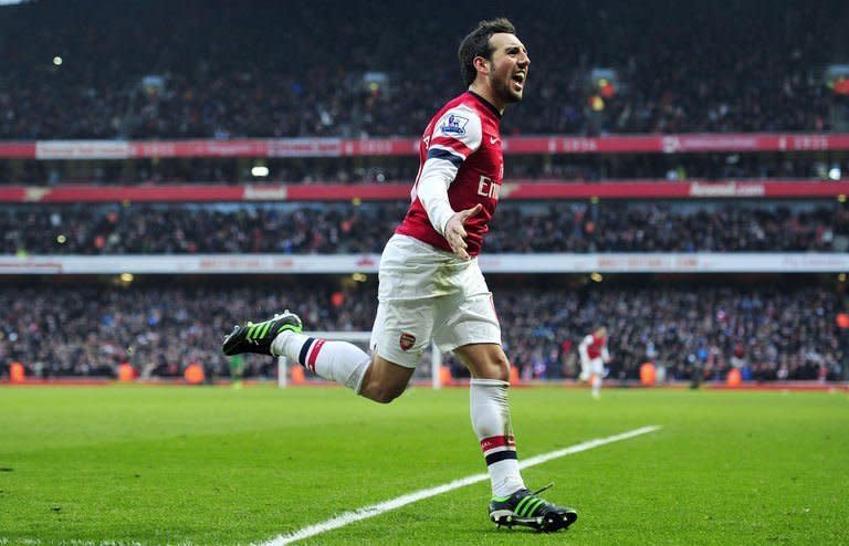 Arsenal midfielder Santi Cazorla celebrates scoring against Aston Villa on February 23, 2013. Arsenal put their recent woes behind them as Cazorla completed a brace with an 85th-minute goal that condemned relegation-threatened Aston Villa to a 2-1 defeat at the Emirates