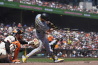 Pittsburgh Pirates' Jared Triolo, right, hits a groundout to San Francisco Giants shortstop Tyler Fitzgerald during the fifth inning of a baseball game Sunday, April 28, 2024, in San Francisco. Pirates' Edward Olivares scored on the play. (AP Photo/Godofredo A. Vásquez)