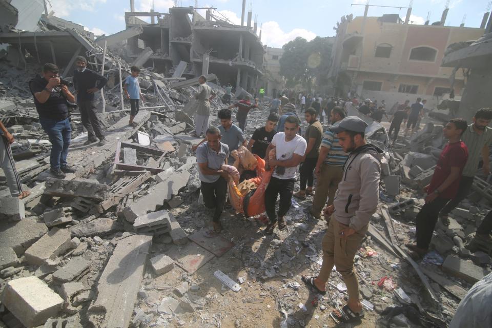 Palestinians evacuate wounded in Israeli bombardment of Rafah, southern Gaza Strip, Tuesday, Oct. 17, 2023.