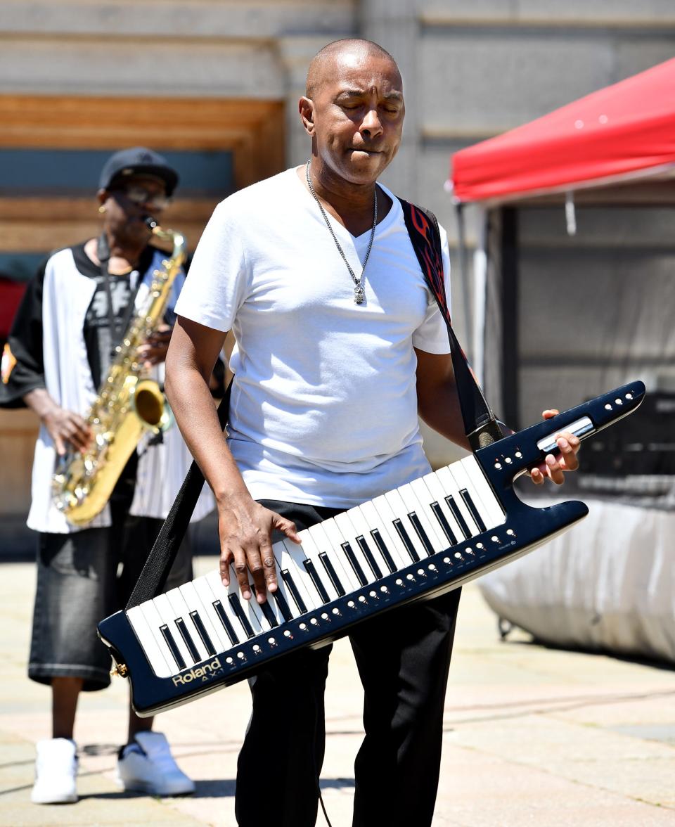 K Fingers, a Worcester native and New England-based R&B, hip-hop, and jazz-funk, keyboardist, producer, composer and performer plays with saxophonist Bobby J, left, during the Black Music Festival on Worcester Common.