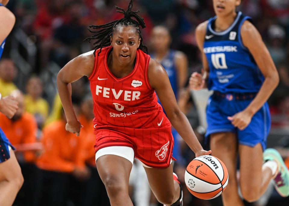 Indiana Fever guard Kelsey Mitchell (0) carries the ball during the season opener against Connecticut Sun on Friday, May 19, 2023 at Gainbridge Fieldhouse in Indianapolis. 