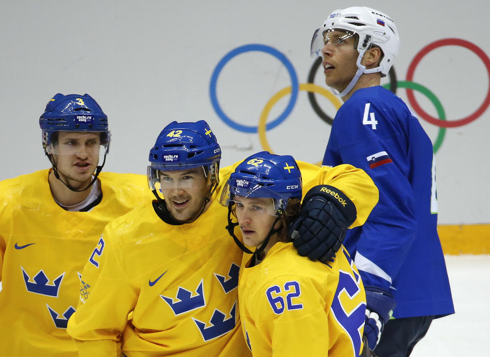 Team Sweden celebrates a goal against Slovenia in the third period of a men's quarterfinal ice hockey game at the 2014 Winter Olympics, Wednesday, Feb. 19, 2014, in Sochi, Russia. Sweden won 5-0. (AP Photo/Mark Humphrey)