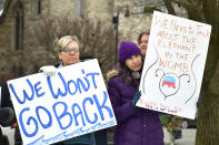 From left, Jessica Dils and Wendy Penner attend a Berkshire Democratic Brigades Roe v. Wade 50th anniversary rally at Park Square in Pittsfield, Mass., on Sunday, Jan. 22, 2023. (Gillian Jones/The Berkshire Eagle via AP)
