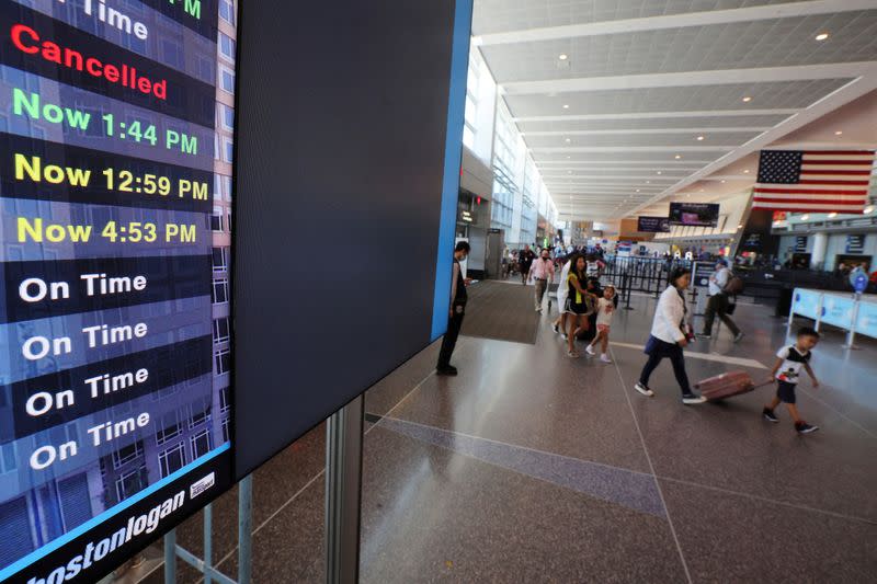 FILE PHOTO: Travelers at Logan Airport ahead of the July 4th holiday weekend in Boston