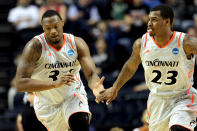 NASHVILLE, TN - MARCH 16: Yancy Gates #34 of the Cincinnati Bearcats celebrates with teammate Sean Kilpatrick #23 after a play against the Texas Longhorns during the second round of the 2012 NCAA Men's Basketball Tournament at Bridgestone Arena on March 16, 2012 in Nashville, Tennessee. (Photo by Jamie Squire/Getty Images)