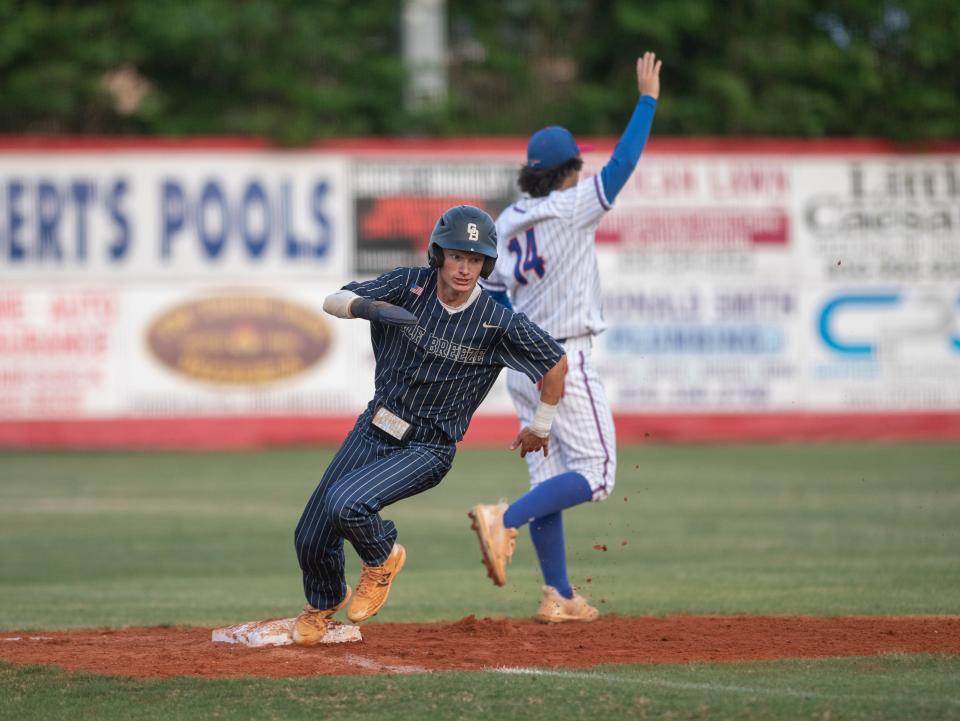 Caden Conway (6) rounds third and heads home to give the Dolphins a 2-0 lead in the 1st inning during the Gulf Breeze vs Pace baseball game at Pace High School on Thursday, April 28, 2022.