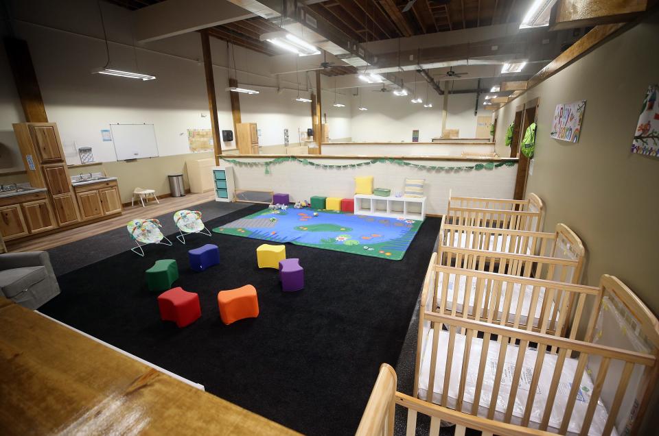 Cribs line the wall of one of the infant areas Treetop Village Campus and Infant Center in Port Orchard on Monday, April 29, 2024.