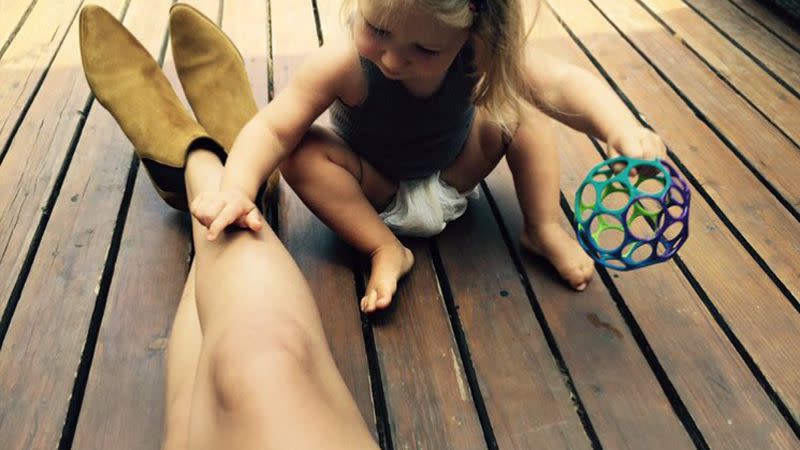 Gracie and Selena playing on a deck