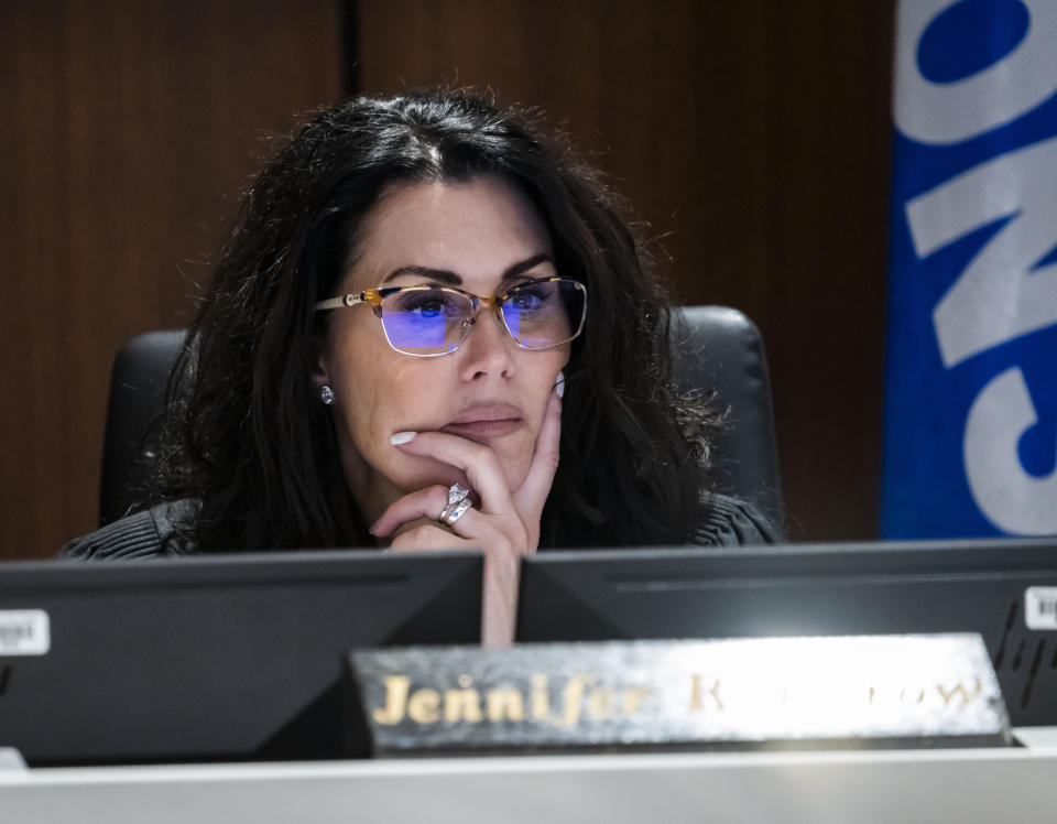 Waukesha County Circuit Court Judge Jennifer Dorow listens as defendant Darrell Brooks questions a witness during his trial in a Waukesha County Circuit Court in Waukesha, Wis., on Thursday, Oct. 20, 2022. Brooks, who is representing himself during the trial, is charged with driving into a Waukesha Christmas Parade last year, killing six people and injuring dozens more. (Scott Ash/Milwaukee Journal-Sentinel via AP, Pool)