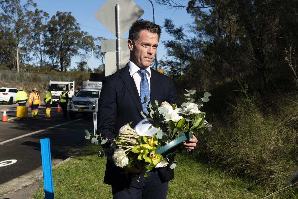 NSW Premier Chris Minns lays a wreath at the public memorial of a fatal bus crash. Source: AAP