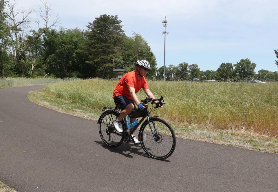 Larry Eiseman of Akron rides along the Freedom Trail from the Middlebury Road Trailhead on Saturday in Tallmadge.