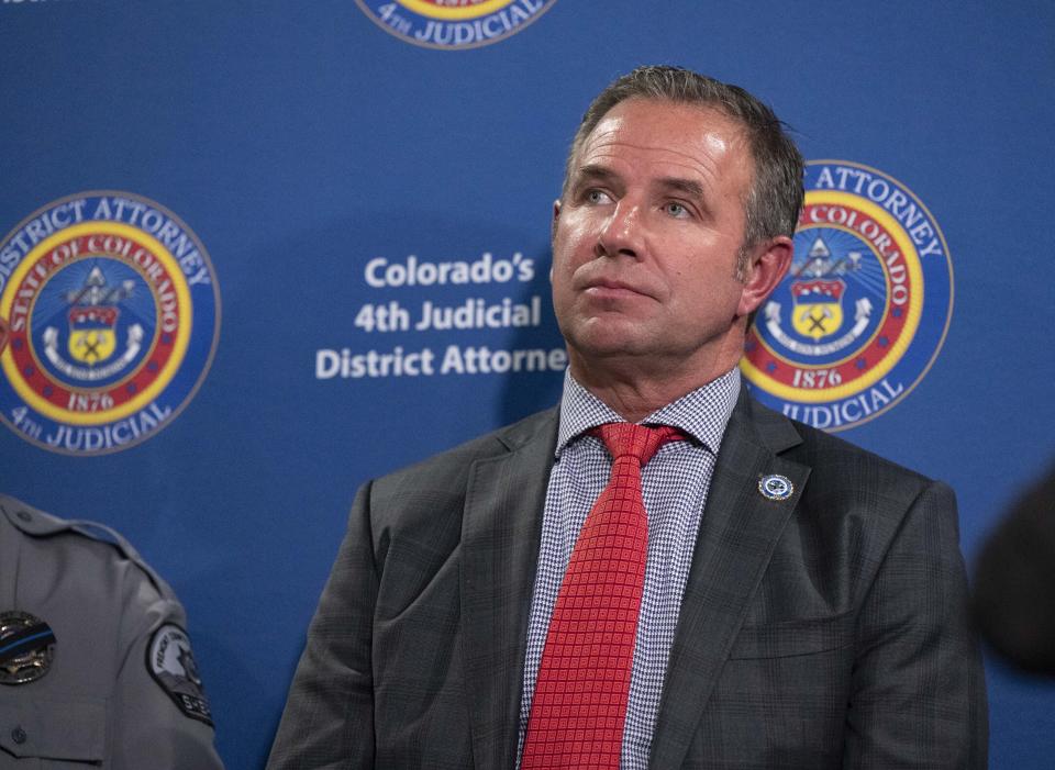 Colorado Bureau of Investigation director Chris Schaefer listens during a press conference at the 4th Judicial District Attorney's Office in Colorado Springs, Colo., Wednesday, Nov. 8, 2023, announcing the arrest of Jon and Carie Hallford, of Nature Funeral Home in Penrose, on suspicion of four felonies: abuse of a corpse, theft, money laundering and forgery. Christian Murdock/The Gazette via AP)