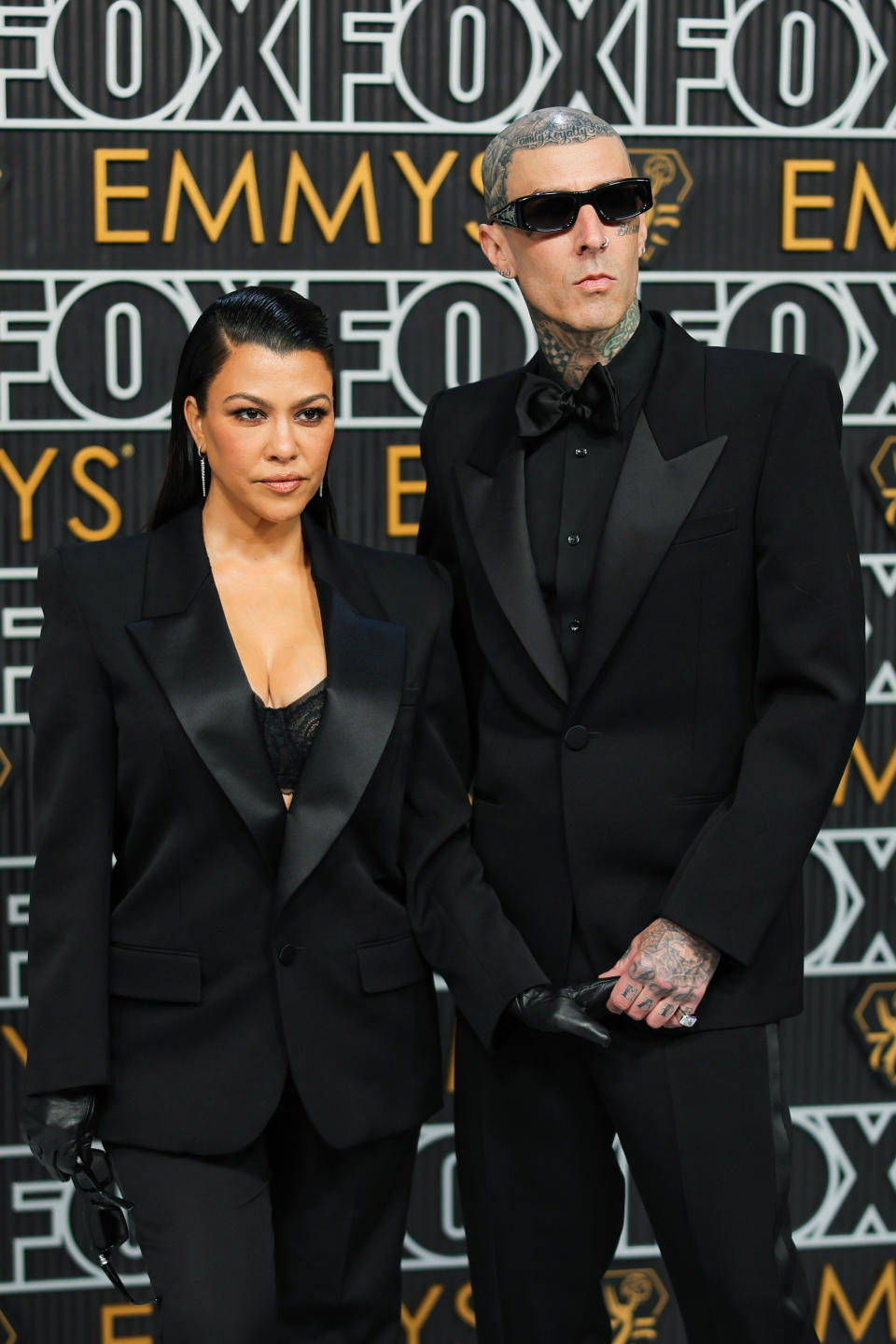 LOS ANGELES, CALIFORNIA - JANUARY 15: (L-R) Kourtney Kardashian and Travis Barker attend the 75th Primetime Emmy Awards at Peacock Theater on January 15, 2024 in Los Angeles, California. (Photo by Neilson Barnard/Getty Images)