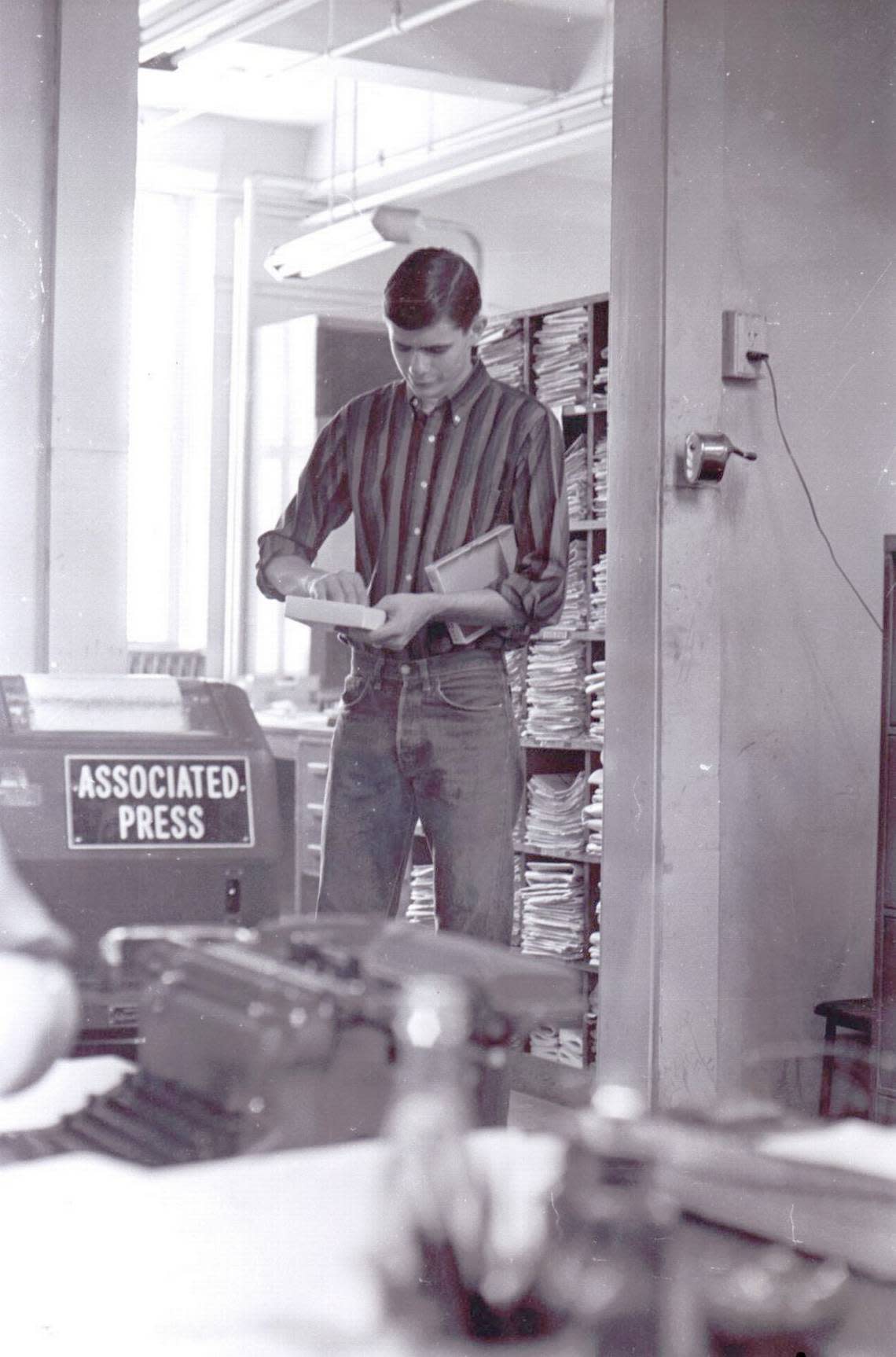 Mike Tharp as a copy boy in the Topeka Capital-Journal newsroom.