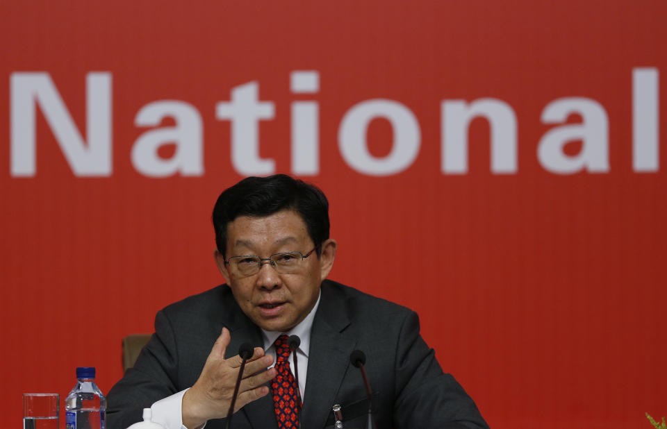 Chinese Commerce Minister Chen Deming speaks at a press conference during the 18th Communist Party Congress in Beijing Saturday, Nov. 10, 2012. (AP Photo/Vincent Yu)