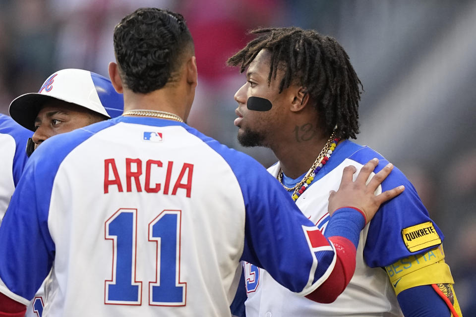 Atlanta Braves right fielder Ronald Acuna Jr. (13) is held back in the first inning of a baseball game against the Pittsburgh Pirates Saturday, Sept. 9, 2023, in Atlanta. (AP Photo/Brynn Anderson)