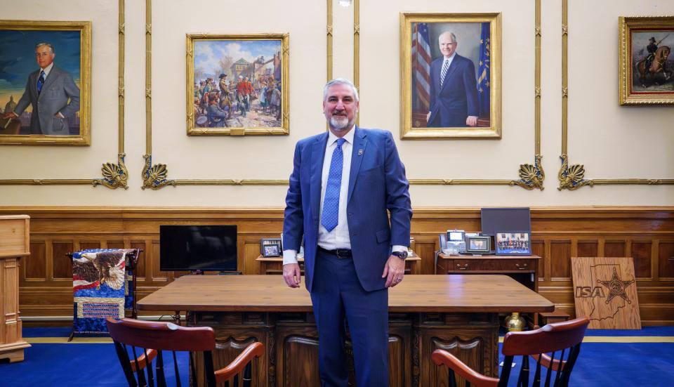 Indiana Gov. Eric Holcomb poses for a photo Monday, Dec. 18, 2023, inside his Indiana Statehouse office. Holcomb is entering his last year of his second term as governor. "I'm proud of what this team has accomplished over an eight year period," he said in an interview with IndyStar. "We've ushered in a number of programs that I'm pretty darn proud of, one of which is a big health initiative that's in its infancy right now. But it is going to positively affect 86 of 92 counties that opted in."