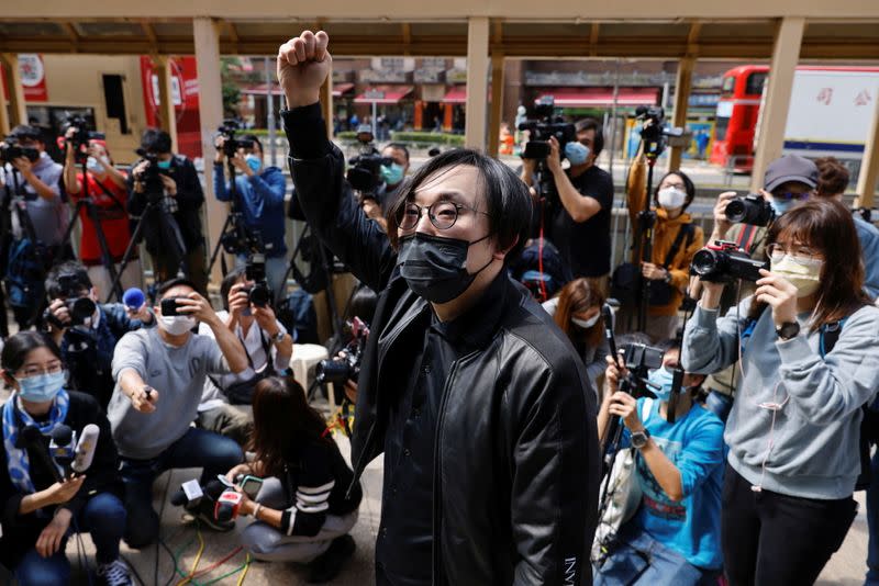 Pro-democracy activist Mike Lam King-nam arrives to report to the police station over national security law charges