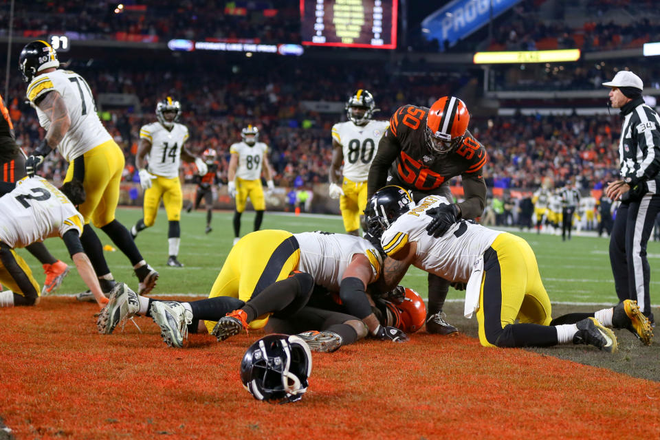 Pittsburgh Steelers center Maurkice Pouncey (53) and Pittsburgh Steelers offensive guard David DeCastro (66) take down Cleveland Browns defensive end Myles Garrett. (Photo by Frank Jansky/Icon Sportswire via Getty Images)