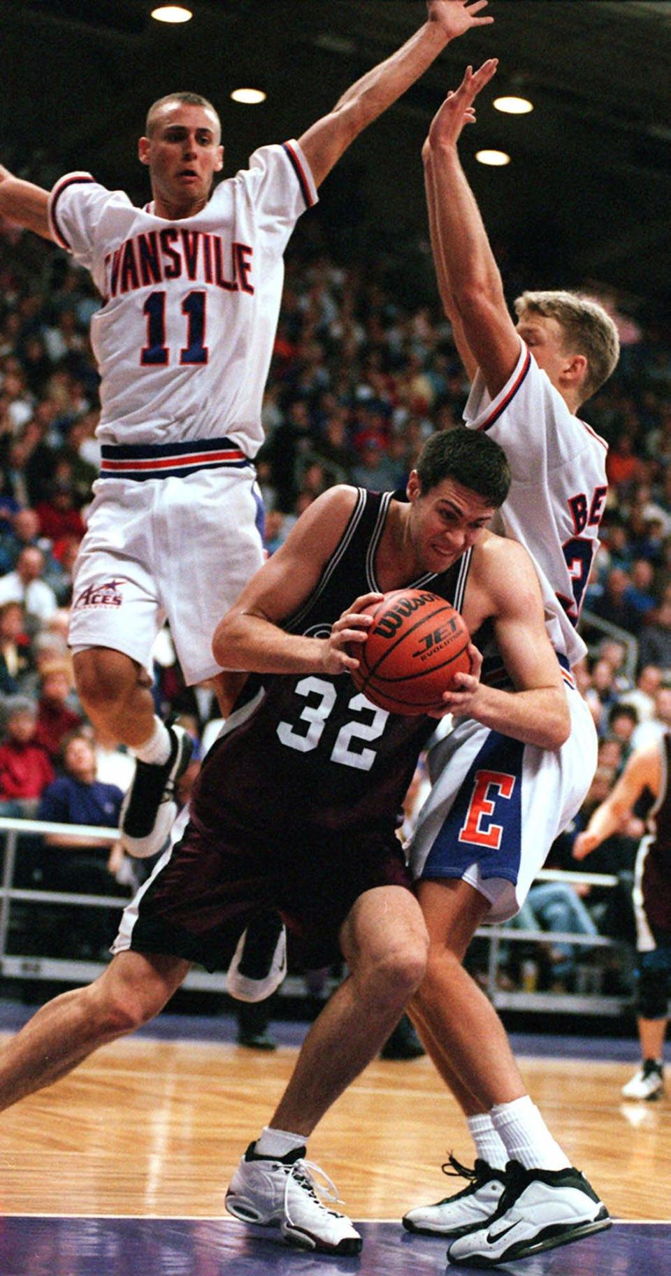 -

-Southwest Missouri State's Danny Moore drives around Evansville's Craig Snow, right, and Jeremy Stanton, left rear, in the first half at Roberts Stadium in Evansville, Ind., Monday, Feb. 22, 1999. (AP Photo/The Evansville Courier & Press, Gary Admire)