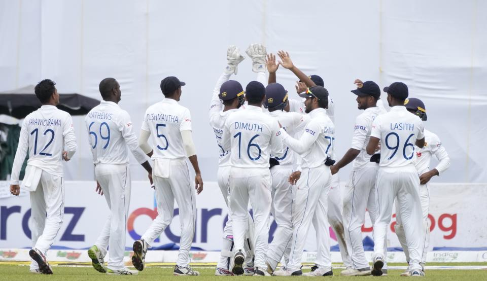 Sri Lankan team members celebrate the wicket of West Indies batsman Rahkeem Cornwall bats during the fifth day of their first test cricket match in Galle, Sri Lanka, Thursday, Nov. 25, 2021. (AP Photo/Eranga Jayawardena)