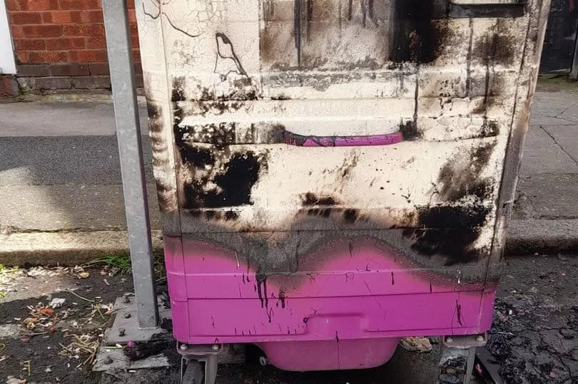 A burnt out communal waste bin in Kensington