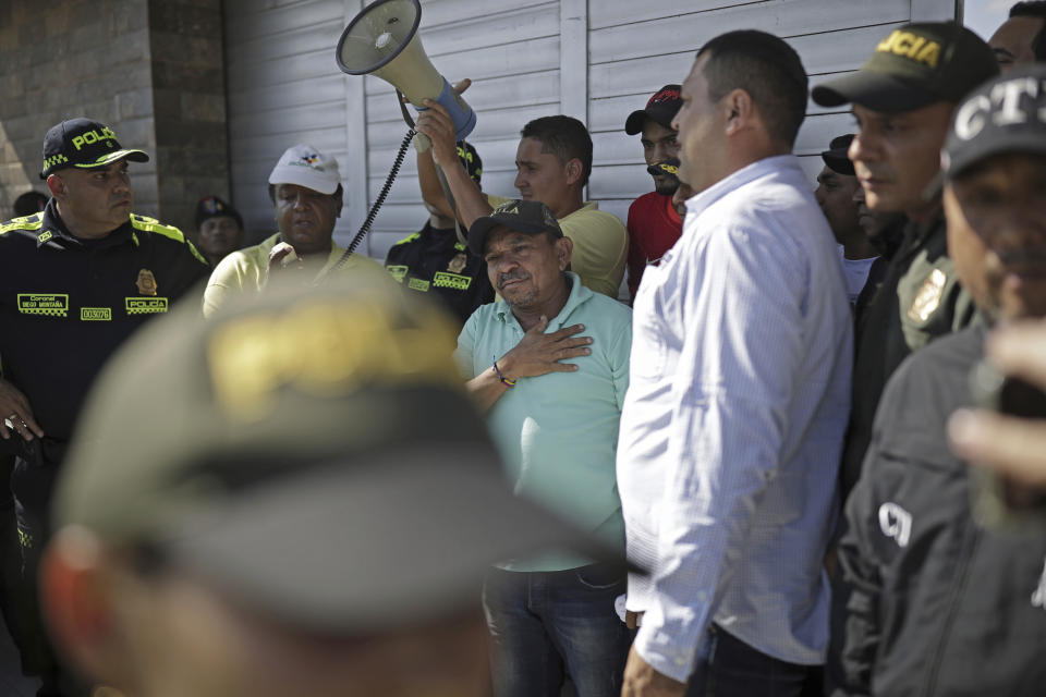 Luis Manuel Díaz speaks to neighbors at his home in Barrancas, Colombia, after after he was released by his kidnappers, Thursday, Nov. 9, 2023. Díaz, the father of Liverpool striker Luis Díaz, was kidnapped on Oct. 28 by the guerrilla group National Liberation Army, or ELN. (AP Photo/Ivan Valencia)