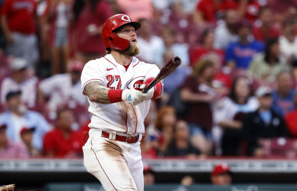 Cincinnati Reds Jake Fraley watches his two-run home run against the Philadelphia Phillies during the third inning of a baseball game in Cincinnati on Tuesday, Aug. 16, 2022. (AP Photo/Paul Vernon)