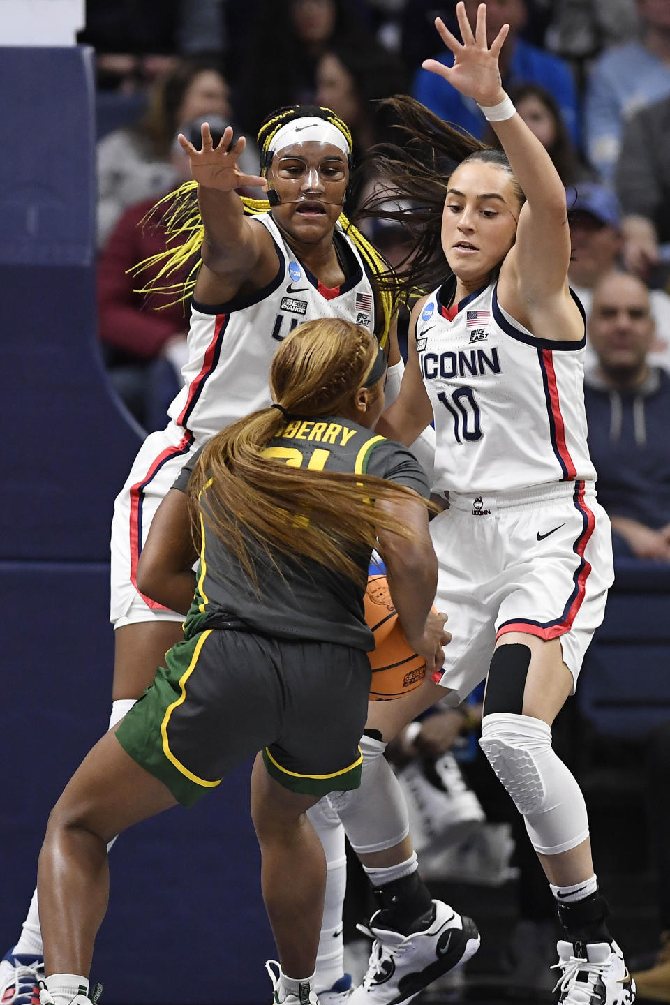 UConn's Aaliyah Edwards, left, and Nika Muhl, right, defend against Baylor's Ja'Mee Asberry in the first half of a second-round college basketball game in the NCAA Tournament, Monday, March 20, 2023, in Storrs, Conn. (AP Photo/Jessica Hill)