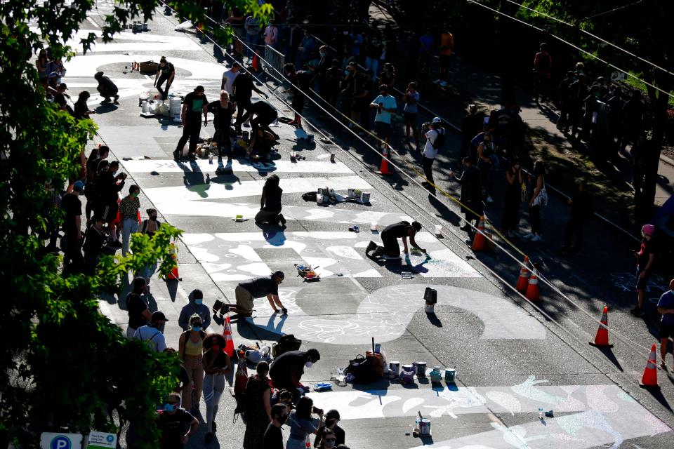 The words "Black Lives Matter" are painted in the middle of East Pine Street.