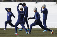 Members of the U.S. men's national team stretch during practice in Columbus, Ohio, Wednesday, Jan. 26, 2022, ahead of Thursday's World Cup qualifying match against El Salvador. (AP Photo/Paul Vernon)