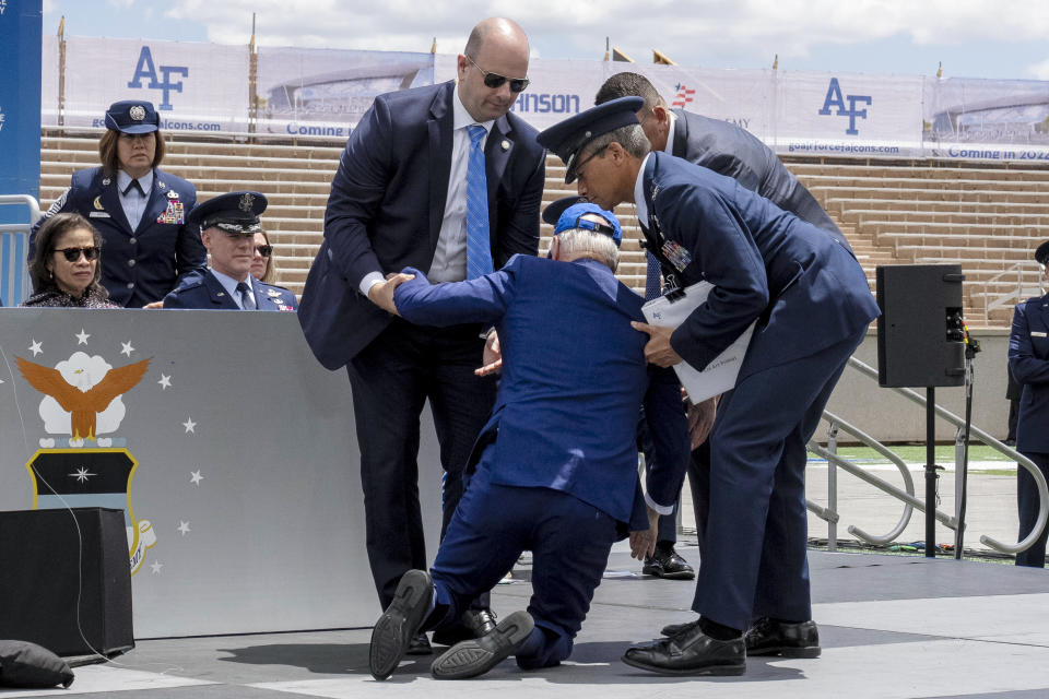 President Joe Biden falls on stage during the 2023 United States Air Force Academy Graduation Ceremony at Falcon Stadium, Thursday, June 1, 2023, at the United States Air Force Academy in Colorado Springs, Colo. (AP Photo/Andrew Harnik)