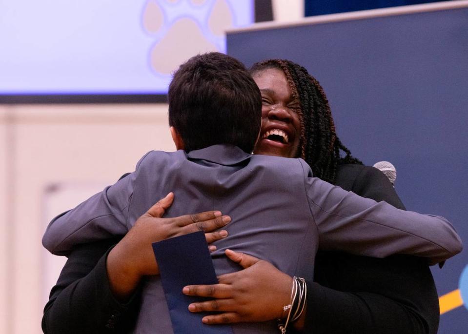 Pearsontown Elementary School Principal Asia Cunningham hugs Stephanie Bishop after receiving a Milken Educator Award on Friday, Nov. 3, 2023, in Durham, N.C.