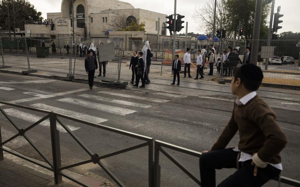 Israelis gather at the scene of a mass shooting near a synagogue in the Jerusalem neighbourhood of Neve Yaakov - Amir Levy/Getty Images