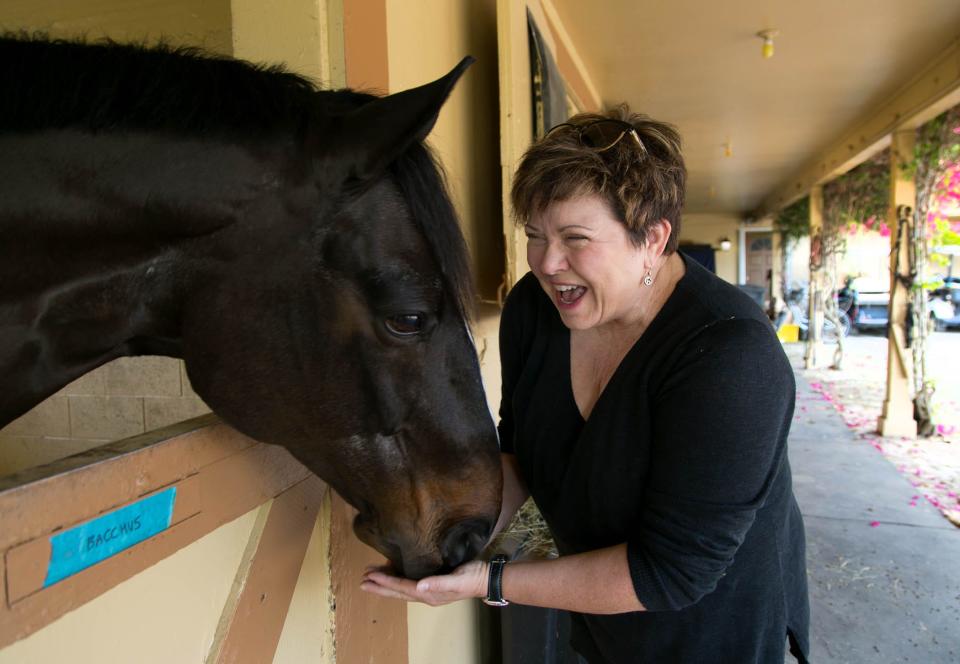 Best-selling mystery writer Tami Hoag is a dressage rider. She is seen here at her barn in Loxahatchee in 2015.