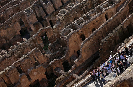 Tourists visit the Colosseum in Rome, Italy, October 17, 2017. Picture taken October 17, 2017. REUTERS/Max Rossi