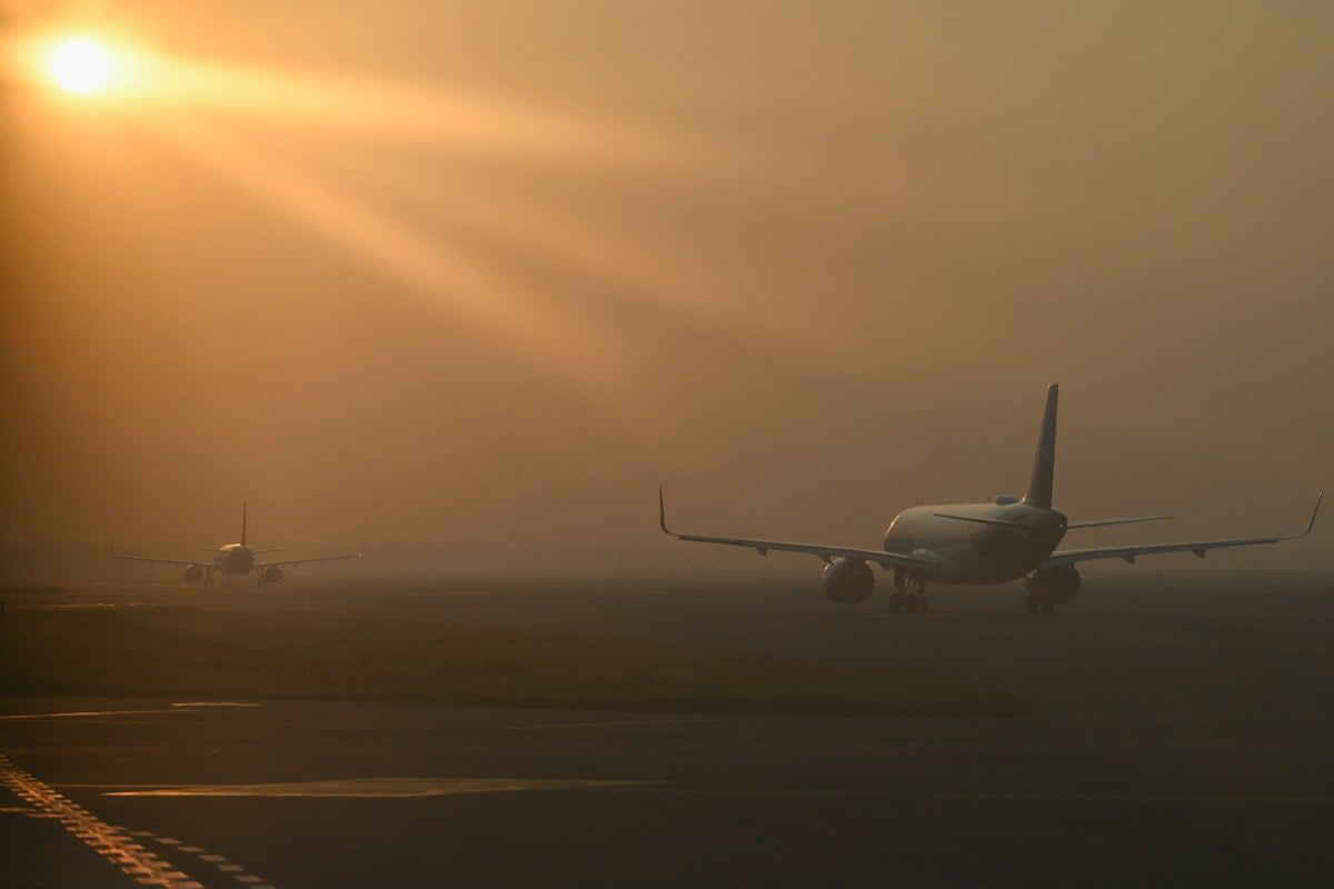 Aircraft line up to take off during heavy air pollution at Indira Gandhi International Airport in New Delhi (AFP via Getty Images)