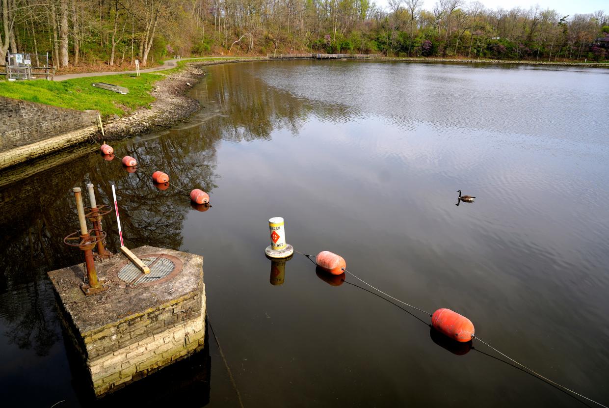 The picture shows the stone enclosure that contains the valve that drains the lake.