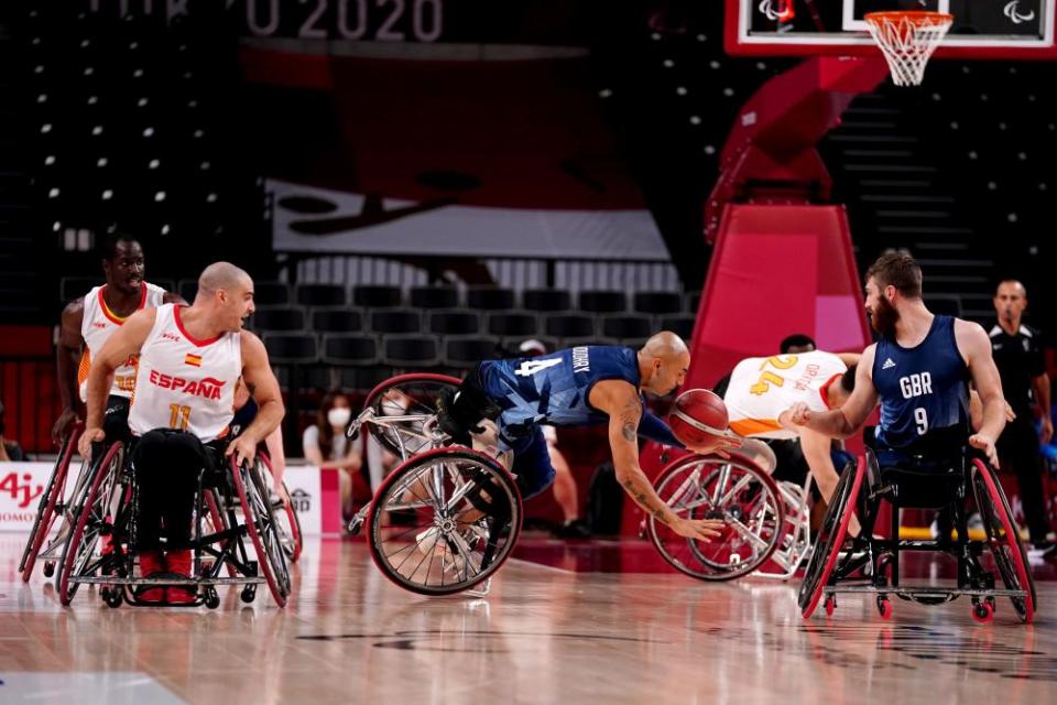 Top scorer Gaz Choudhry being unseated during the wheelchair basketball bronze medal match.