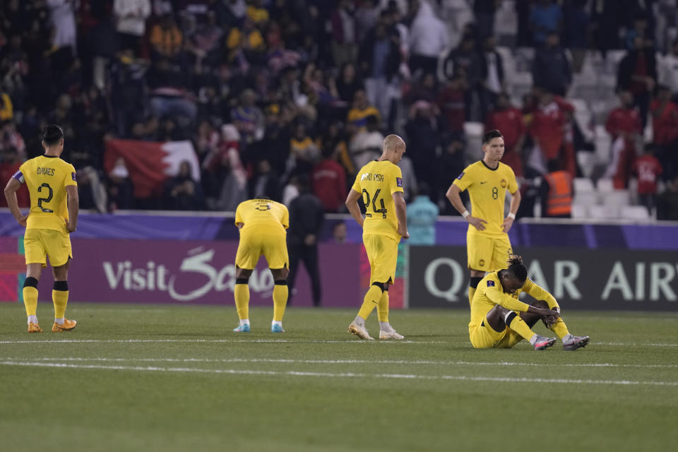 Malaysian players react after their loss in the Asian Cup Group E soccer match between Malaysia and Bahrain at Jassim bin Hamad Stadium in Doha, Qatar, Saturday, Jan. 20, 2024. (AP Photo/Thanassis Stavrakis)