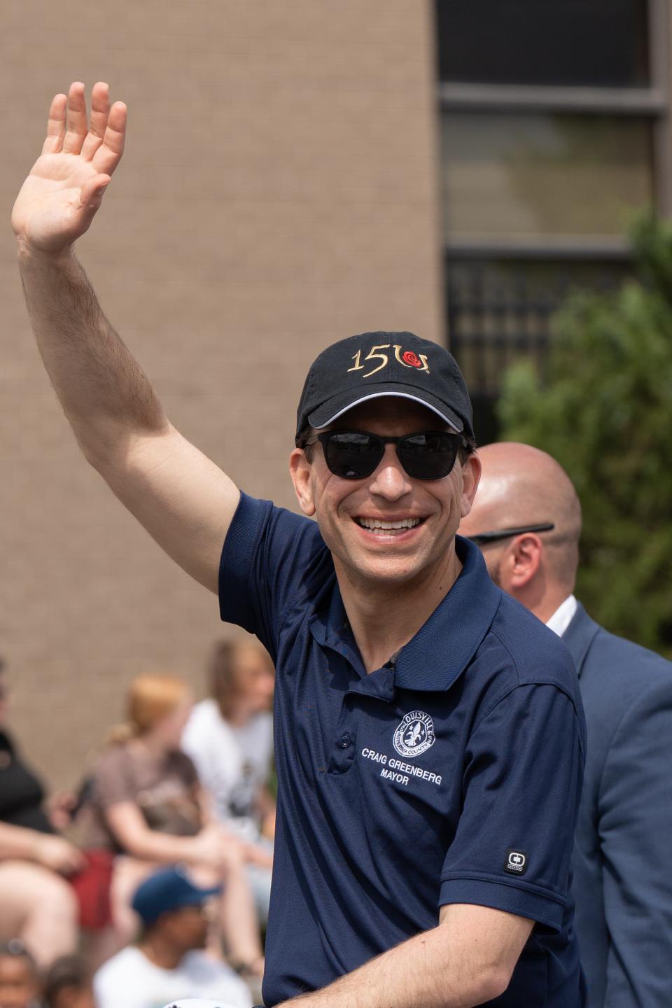 Mayor of Louisville, Craig Greenberg waves to the crowd as he drives down W Broadway during the 2024 Pegasus Parade during the Kentucky Derby Festival on Sunday, April 28, 2024.