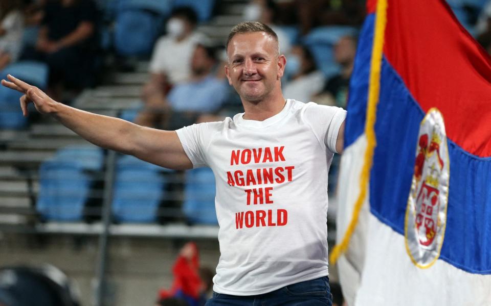 Serbia fans display their flag in support of Novak Djokovic during the group stage match between Spain's Roberto Bautista Agut and Serbia's Dusan Lajovic - Reuters