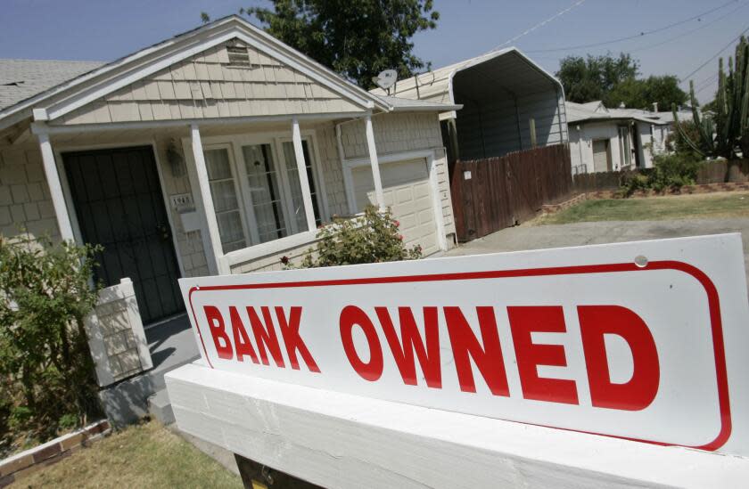 A sign of a house under foreclosure is shown in Antioch, Calif., Thursday, Aug. 14, 2008. (AP Photo/Paul Sakuma)
