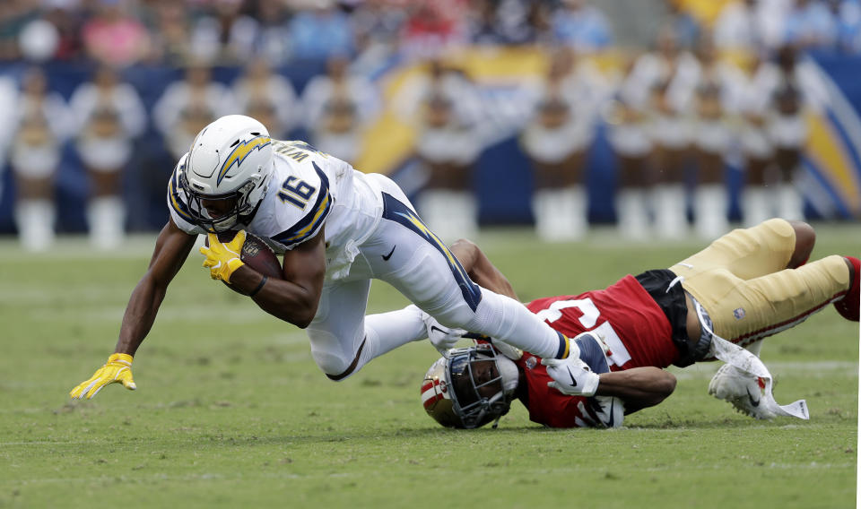 Los Angeles Chargers wide receiver Tyrell Williams, left, is tackled by San Francisco 49ers cornerback Ahkello Witherspoon during the first half of an NFL football game, Sunday, Sept. 30, 2018, in Carson, Calif. (AP Photo/Marcio Sanchez)