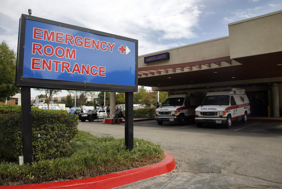 FILE - This Friday, Sept. 30, 2011, file photo shows the emergency room entrance at the Henry Mayo Newhall Memorial Hospital in Santa Clarita, Calif. In hard-hit Los Angeles County, Nerissa Black, a nurse at Henry Mayo Newhall Hospital, estimated she's been averaging less than 10 minutes of care per patient every hour. That includes not just bedside care, but donning gear, writing up charts, reviewing lab results and conferring with doctors, she said. "And the patients who are coming in are more sick now than they've ever been, because a lot of people are waiting before they get care. So when they do come in, they're really, really sick," Black said Sunday, Dec. 20, 2020. (AP Photo/Jason Redmond, File)