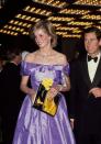 <p>Diana wears a satin lilac evening gown for a night at the St. James Theatre with Charles.<br></p>