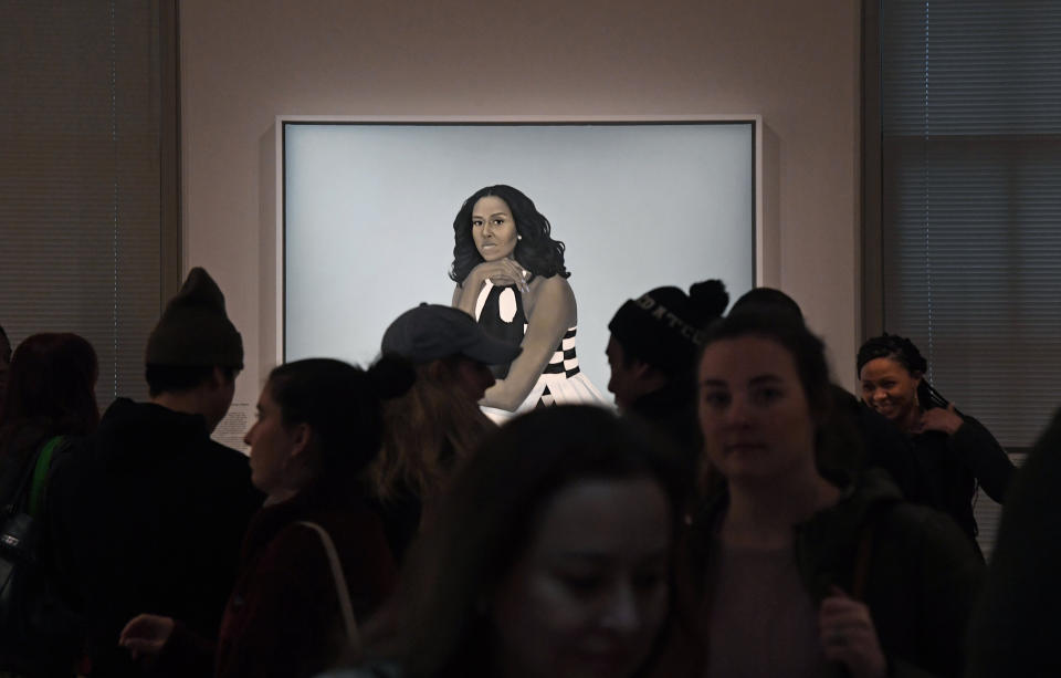 Crowds are often huddled around the portrait of Michelle Obama at the National Portrait Gallery. (Photo: The Washington Post via Getty Images)